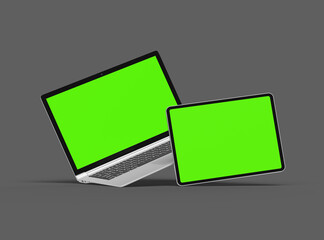 3d render of laptop and tablet with green screen on a dark background