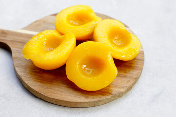Peach halves in syrup. Fruity desserts
