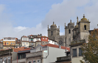 Fototapeta na wymiar View of a part of the city of Porto in Portugal, several buildings that make up the slope of the hill of the Douro river valley, towers of the city's Cathedral