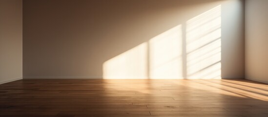 Fototapeta premium A minimalistic room with a wooden floor, sunlight streaming in through a window, casting shadows on the plank wall. The interior is illuminated with warm lighting, showcasing the simple yet elegant