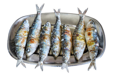 Traditional Portuguese grilled sardines on a metal plate isolated on a white background.