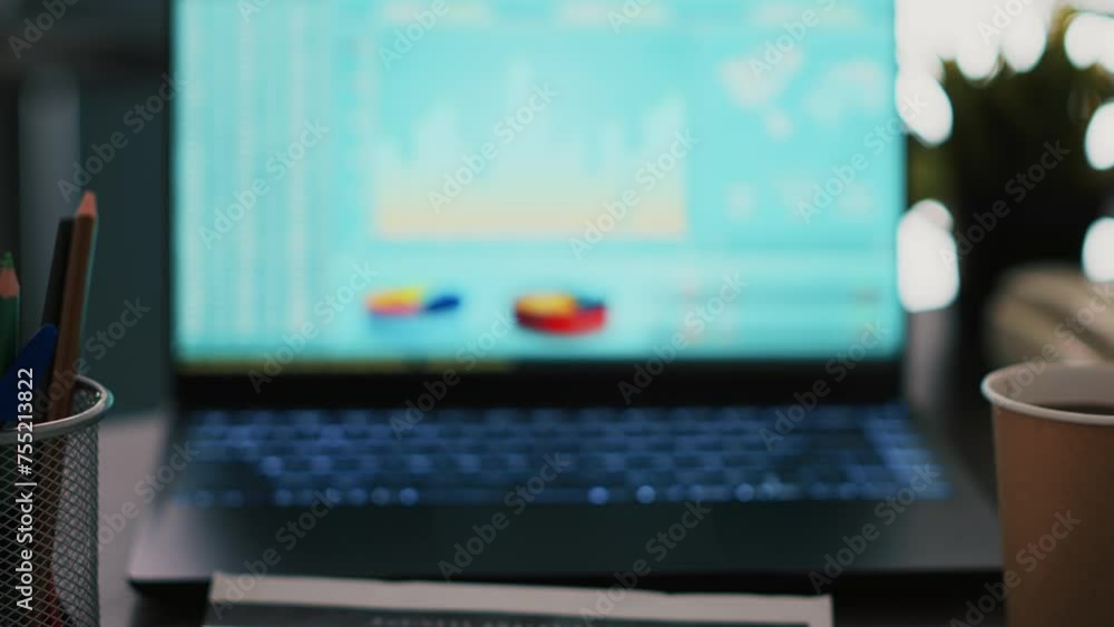 Poster laptop screen in business office shows stock exchange values changing in real time, close up. notebo