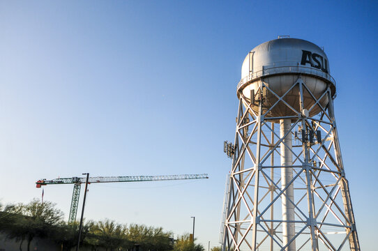Arizona State University&rsquo;s water tower at the Polytechnic campus in Mesa, Arizona, with a tower crane visible in the background