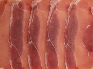 slices of prosciutto or jamon as background