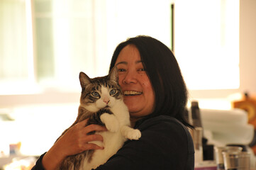 Cat and happy human in the kitchen