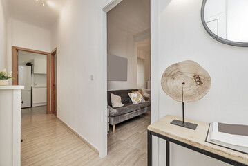 Distributor hallways of a home with light stoneware floors, different white wooden doors and...