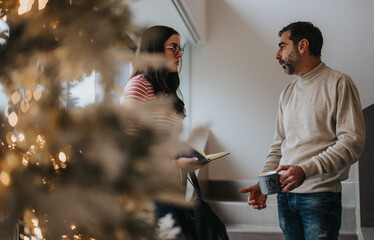 Casual conversation by a festive Christmas tree in a cozy home setting.
