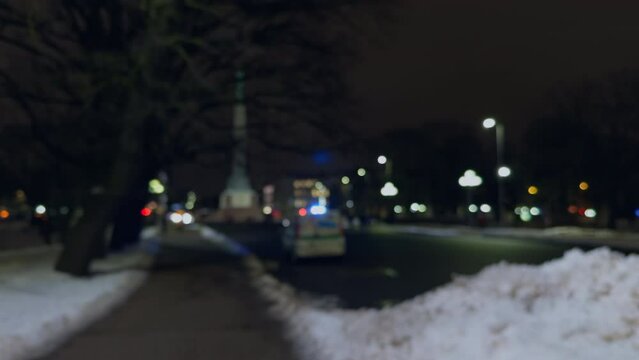 Winter night blur: Emergency lights create a mesmerizing defocused scene