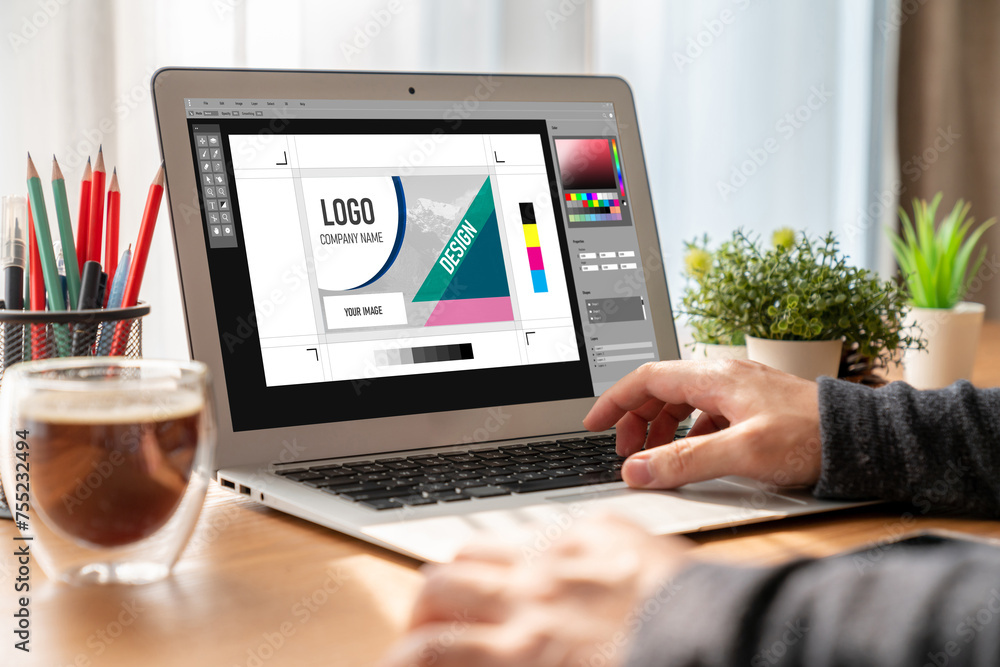 Aufkleber graphic designer software for modern design of web page and commercial ads showing on the computer s