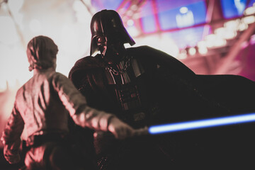 Obraz premium NEW YORK USA, MAR 10 2024: recreation of a scene from Star Wars The Empire Strikes Back with Jedi Luke Skywalker battling Sith lord Darth Vader in the carbonite freezing chamber on Bespin - Hasbro