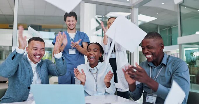 Doctors, celebration and throw documents for news on laptop, success and achievement or goals in teamwork. Medical staff, nurses and people with applause, clapping and wow or paper in air on computer