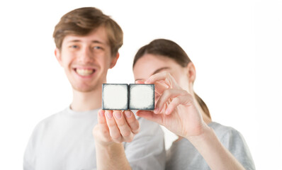 hands with empty cubes. couple showing empty cubes with free space for logo text - 755236290