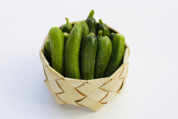 Mini cucumbers on white background.