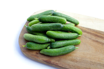 Mini cucumbers on white background.