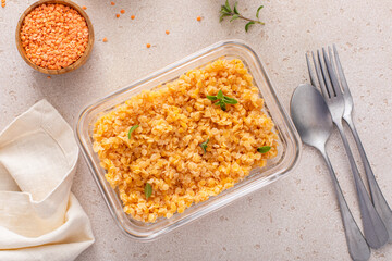 Cooked red lentils in a meal prep container, healthy vegan protein source - 755238039