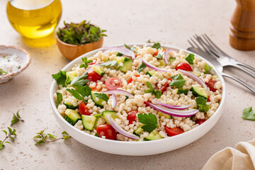 Pearl couscous salad with fresh vegetables and herbs, healthy side dish idea - 755238228