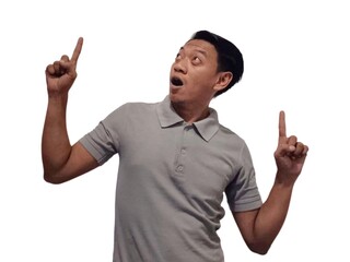 Wow and shock face of young Asian man in gray t-shirt with hands pointing up empty space.