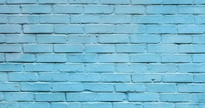 Video background of light blue brick wall. Texture of a brick wall. Modern wallpaper design for web or graphic art projects. Abstract background for social media, banners or presentations