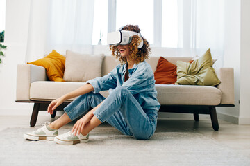 Smiling Woman Enjoying Virtual Reality Game with VR Goggles on Sofa in Modern Living Room