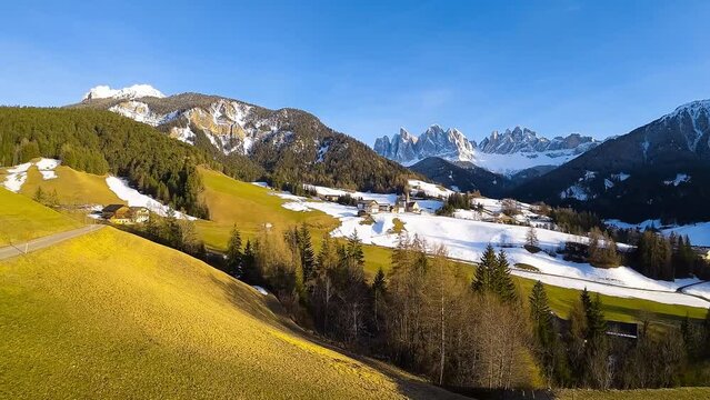 Aerial FPV drone view of spring landscape Dolomites Alps Santa Maddalena village Val di Funes valley South Tyrol Italy. High quality 4k footage