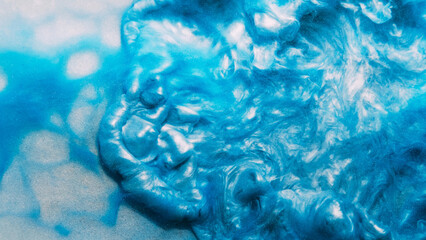 Glitter fluid ink water splash blue paint wave