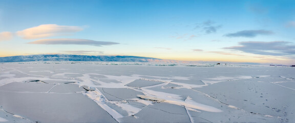 Fototapeta na wymiar Panoramic view of frozen lake Baikal in winter, Russia.