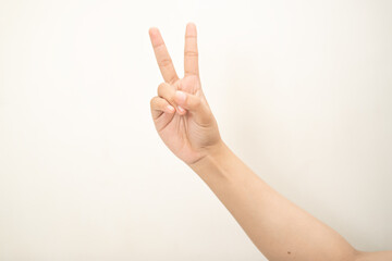 Fototapeta premium Hand pointing at something and make a sign on white background