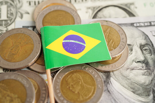 Brazil flag on coins background, finance and accounting, banking concept.