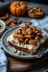 A delicious slice of toast with pecans and cream cheese, served on a plate. This baked goods dish combines the nutty crunch of pecans with the creamy goodness of cream cheese