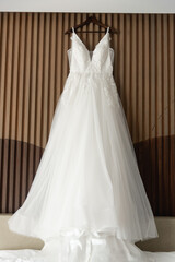 A wedding dress or bridal gown is the dress worn by the bride during a wedding ceremony.