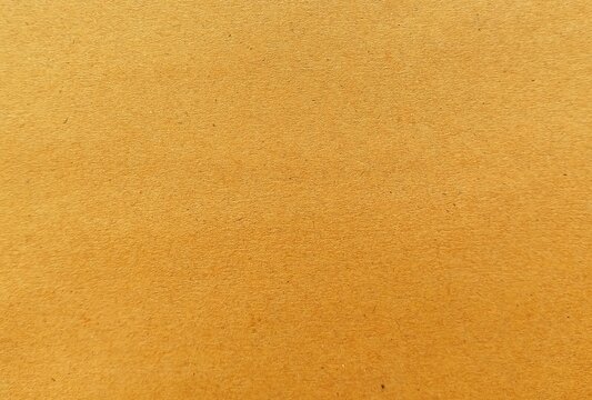 For the design background brown corrugated cardboard texture background. Brown paper cardboard with soft color. Brown corrugated cardboard texture is useful as a background.