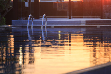 Swimming pool, evening light, stairs to the pool