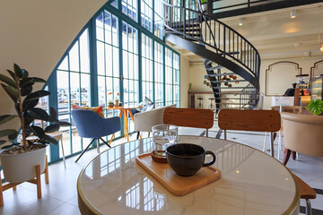 inside coffee shop Simply decorated, on a bright day