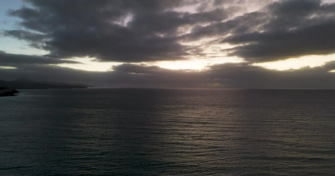 Beautiful sunset over the atlantic ocean on a cloudy day