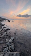 Fototapeta na wymiar Sunset over the Black Sea, Turkey, the city of Ordu, the beautiful expanse of calm sea water.