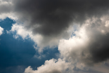 Dramatic dark storm rain clouds black sky background. Dark thunderstorm clouds rainny atmosphere. Meteorology danger windstorm disasters climate. Dark cloudscape storm disaster gloomy gray cloud sky