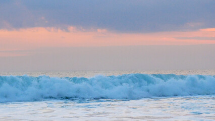Tropical sea beach in summer time on sunny day. Golden sand beach sea peaceful scenery on the beach. Travel vacation seaside outdoor. Ocean island beautiful dramatic landscape. Sunny seascape scene.
