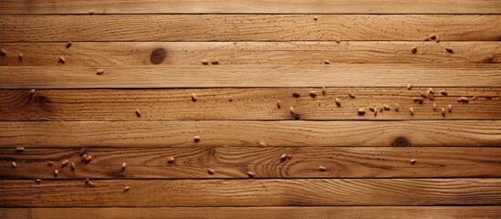 Obraz premium A detailed shot of a brown hardwood plank wall with nails, showcasing the intricate pattern of the wood grain and construction of the building