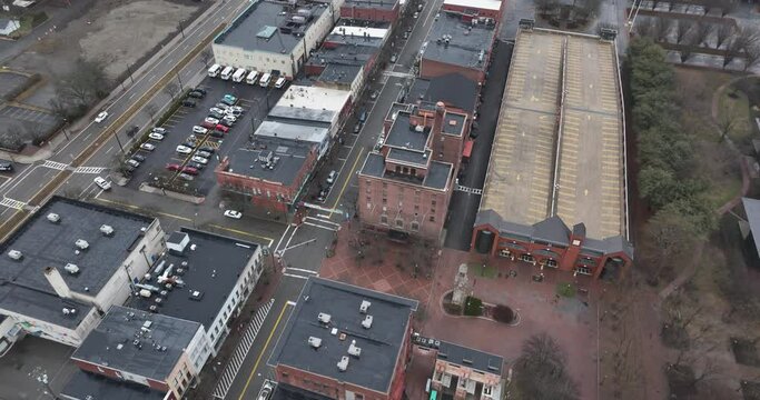 Corning, NY, USA - 03-02-2024 - Cloudy winter aerial video of the downtown area in the City of Corning, NY, year round activity.	