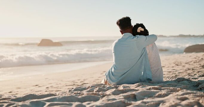 Couple, kissing and love on sand at beach for romance, affection and bonding on honeymoon vacation in Maldives. Black man, woman or happy by ocean for anniversary date, relax or sunrise for adventure