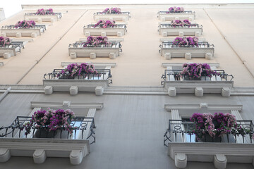 a building with a lot of windows and balconies on it