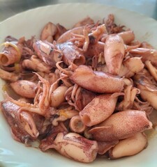 Delicious oyster sauce squid, restaurant-style home cooking. Indonesian seafood. Close-up.
