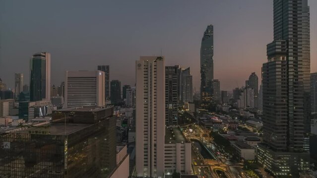 Bangkok business center skyline panoramic aerial view Time lapse, hyperlapse, Thailand, Silom district day to night