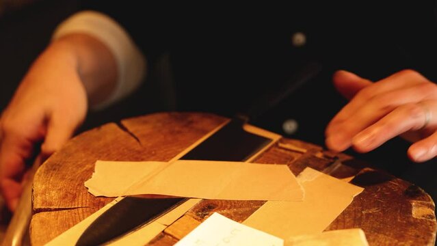 Applying Tape to Secure Knife Blade