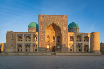 Fototapeta na wymiar Islamic Educational and Spiritual-educational building of the Miri Arab Madrasah on a sunny day, Bukhara, Uzbekistan