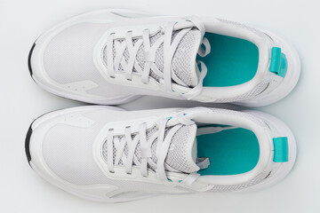 White sport shoes with green sole