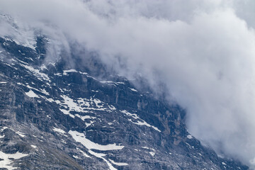 Fototapeta na wymiar Stunning scenic view of snow mountain peaks of Alps in Switzerland. Beautiful Alps Mountain landscape, telephoto shot.