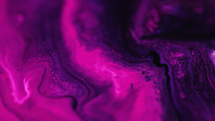 Paint mix. Neon background. Defocused pink purple color glowing glitter acrylic ink particles blend...