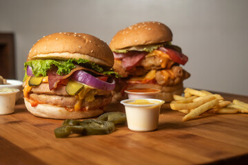 Assorted Burgers with Crispy Chicken Cheese burger with beef bacon isolated on wooden table top...