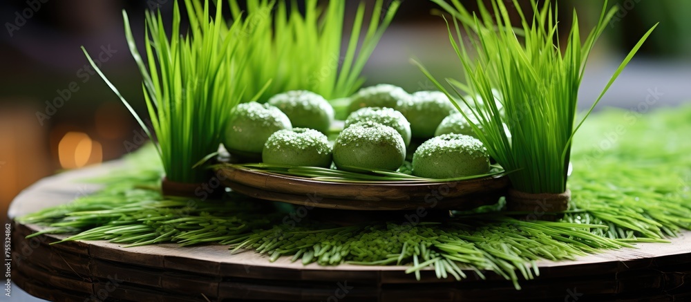 Poster a basket filled with fresh green grass is placed on a sturdy wooden table, creating a simple and rus
